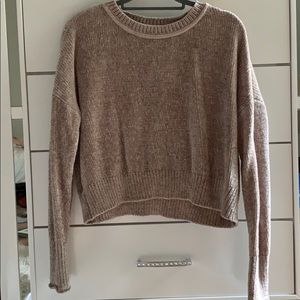 It’s a mix between a sweater and a cropped top.